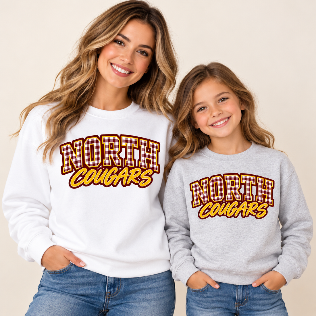 Woman in white and girl in gray North Cougars gingham crewnecks