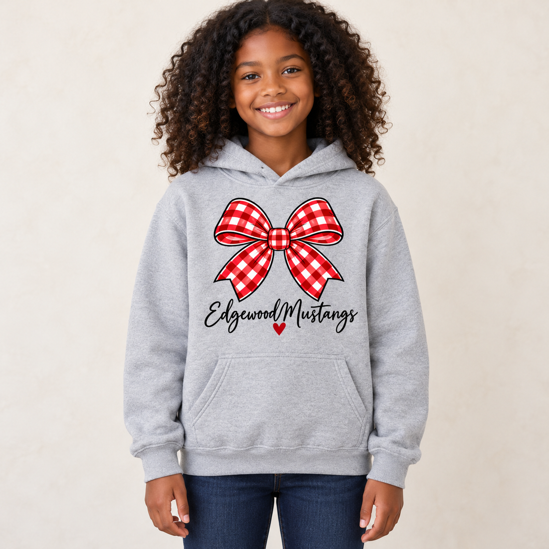 Model wearing Edgewood Mustangs Bow Youth Hoodie in Sport Gray